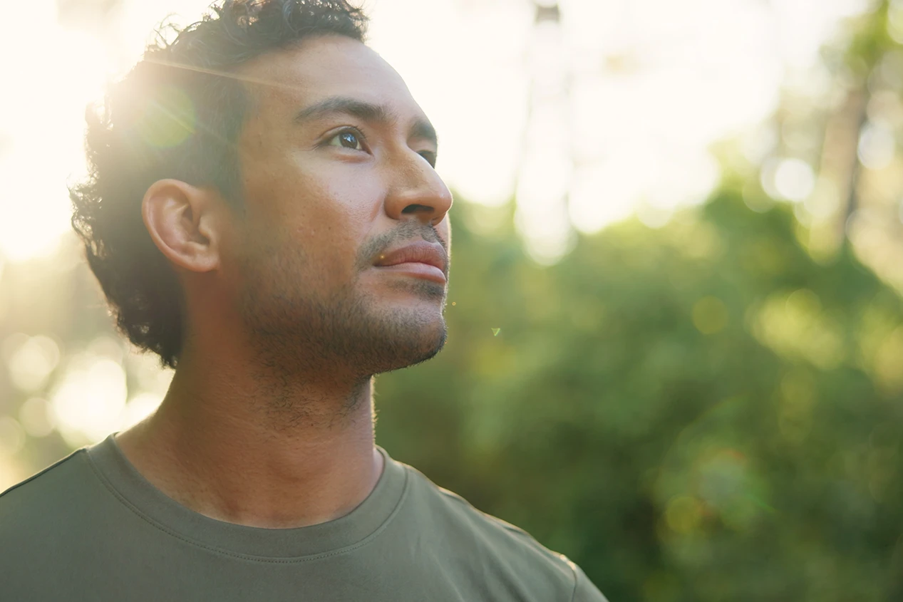A person in a calm, grounded moment of trauma healing